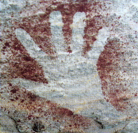 image of hand on rock